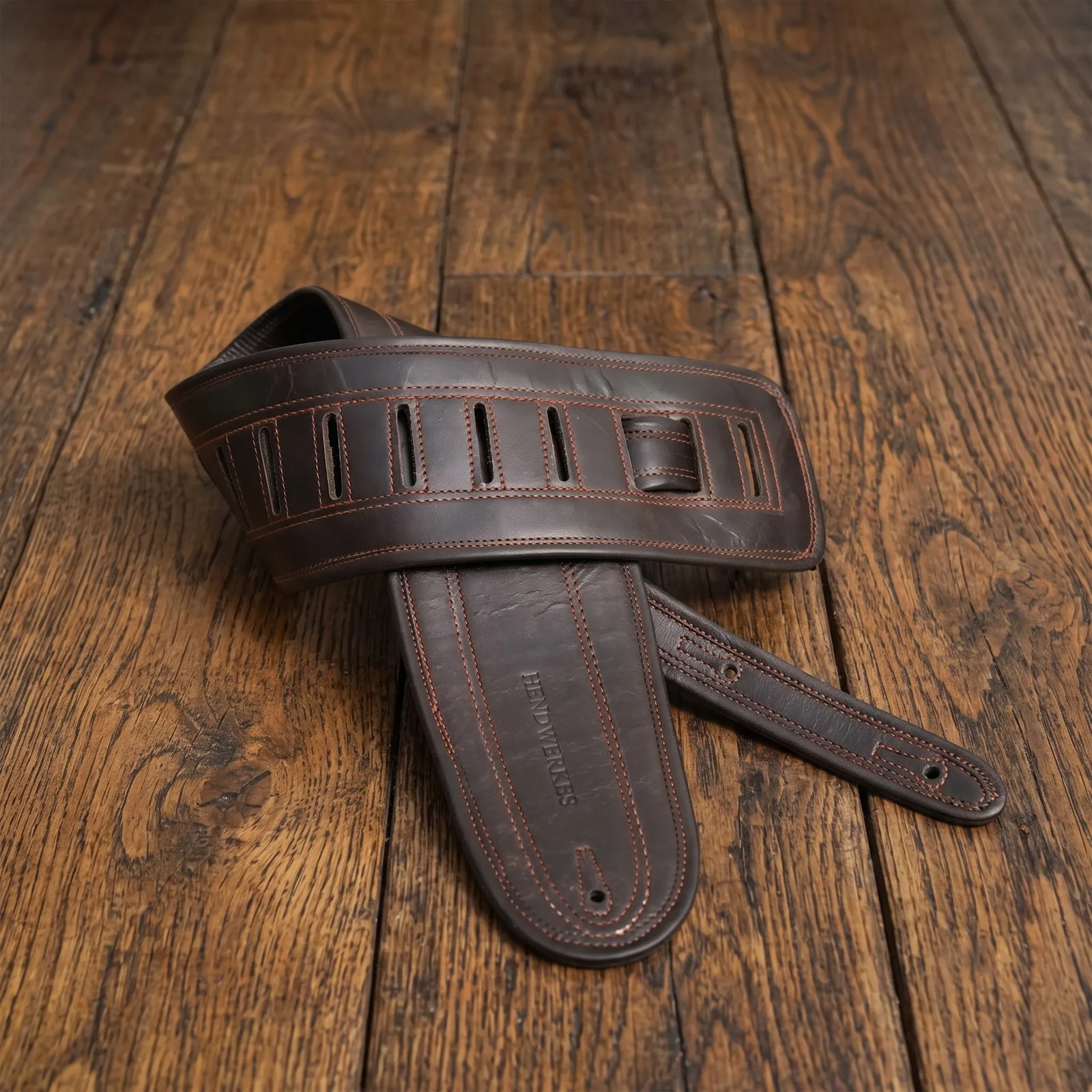 Dark brown heritage strap on wooden floorboards